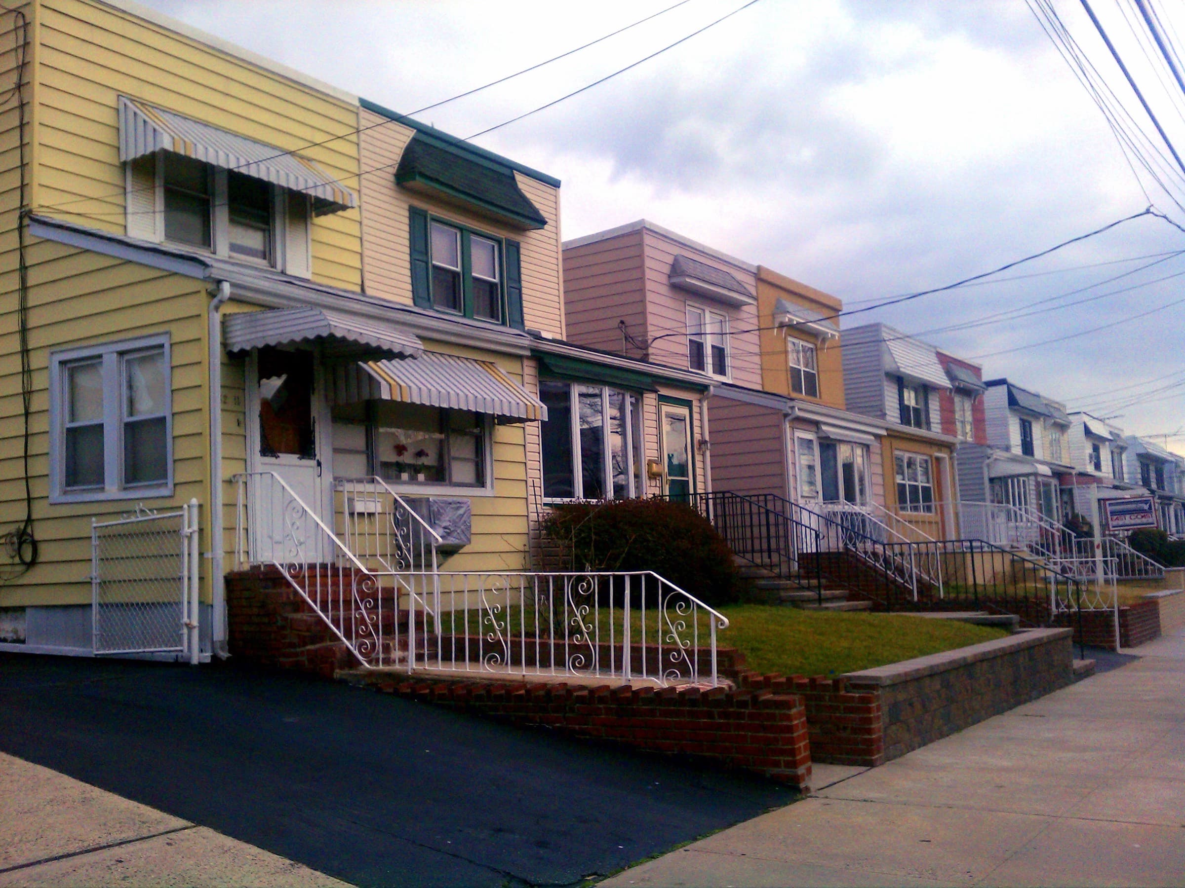 Row of semi-detached one- and two-family houses in Bayside, Queens